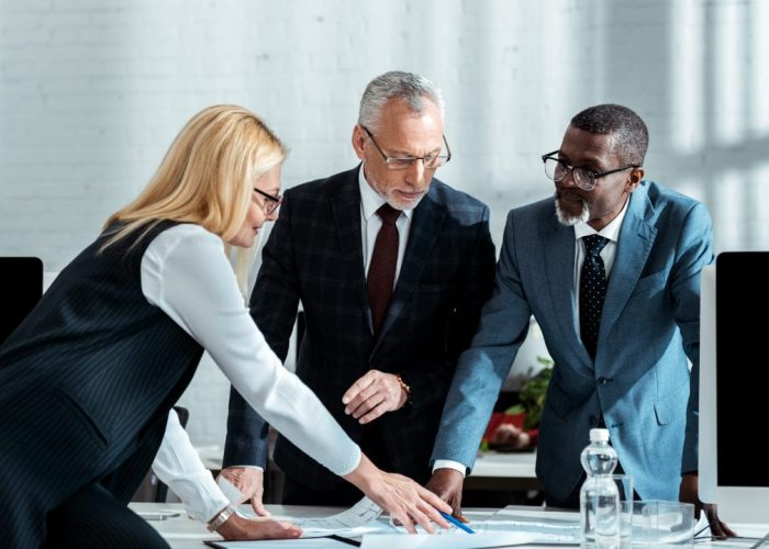 Business men and women working together