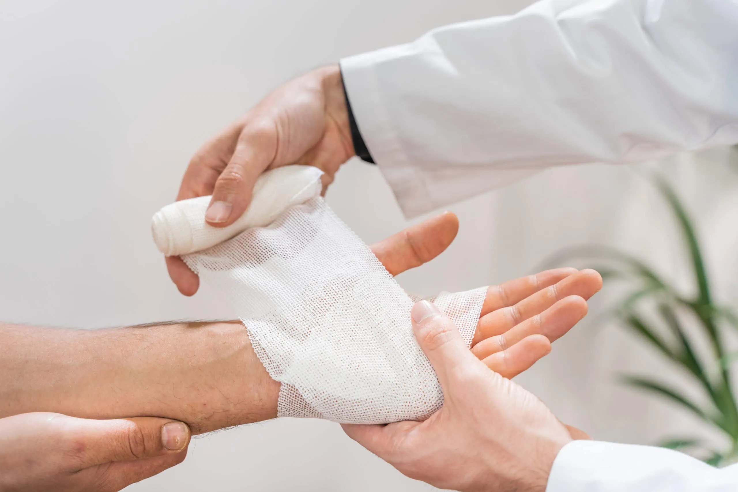 Medical bandage on patient hand in clinic. Traumatology. Hospital. Injured. Therapy. Care. High quality photo